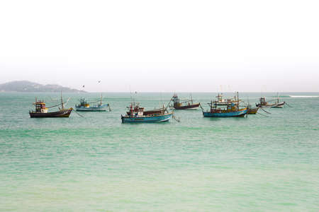 Old fishing boat on a background of blue skyの写真素材