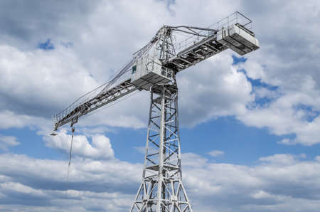 Building crane against the blue sky. Industrial backgroundの写真素材
