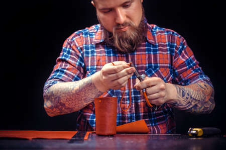 Leather master producing leather goodsの写真素材