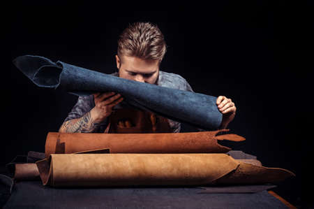 Currier working on a new leather product