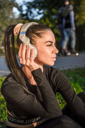 Beautiful woman listening to music with headphonesの写真素材