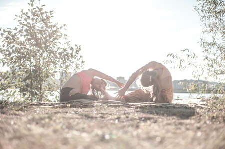 Massage trainer adequately performs a great massage in nature.の写真素材