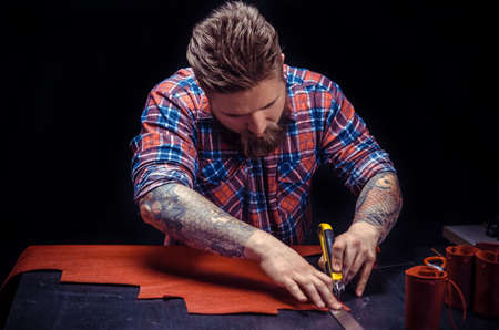 Tanner of leather producing a good product in his workshopの写真素材