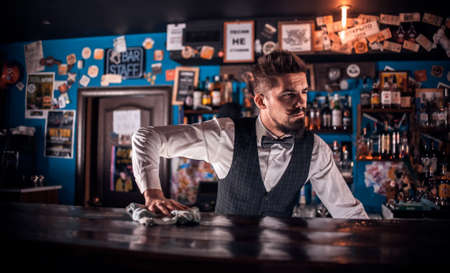 Charming bartending makes a show creating a cocktail in cocktail barsの写真素材