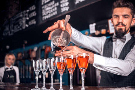 Expert bartending mixes a cocktailの写真素材
