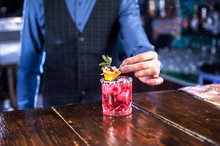 Bartender mixes a cocktail at the pothouseの写真素材