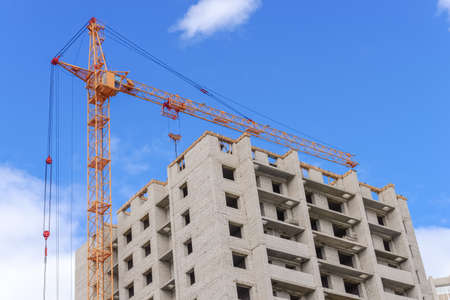 Construction of high-rise houses and hoist craneの写真素材