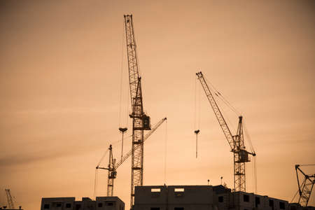 Housing development and highrise cranesの写真素材