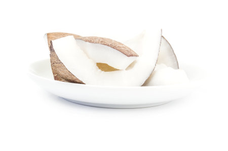Chopped coconut isolated on a white cutoutの写真素材
