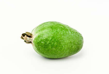 One whole ripe feijoa isolated on white backgroundの写真素材