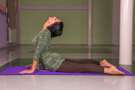 Yoga teacher stretchingの写真素材