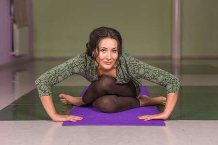Yogi working out in yoga in fitness classの写真素材