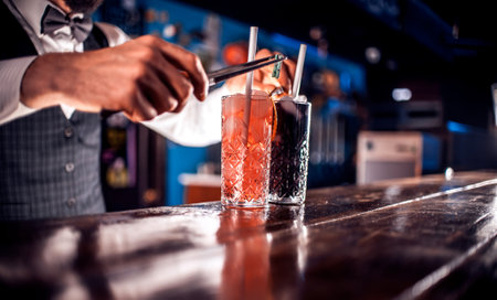 Bartender makes a cocktail at the beerhouseの写真素材