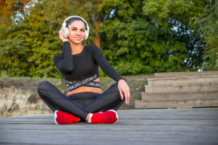 Young beautiful woman listening to music with headphonesの写真素材