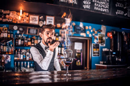 Barman mixes a cocktail on the beerhouseの写真素材