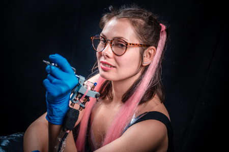 Master tattooist posing in a tattoo studioの写真素材