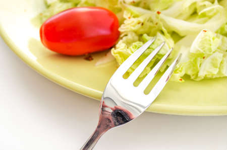 Vegetables salad served on a yellow plateの写真素材
