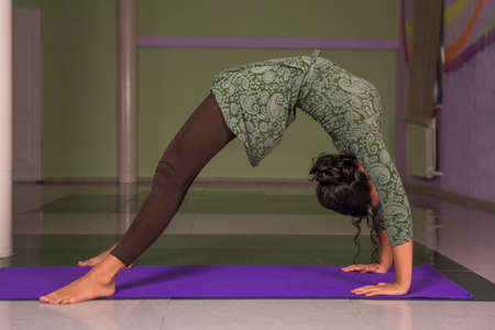 Female stretches yoga posesの写真素材