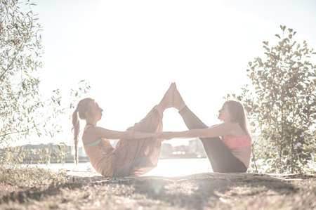 Healer thuroughly massages a girl outside.の写真素材