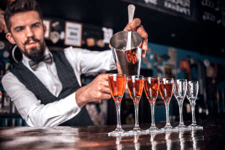 Bartender makes a cocktail at the alehouseの写真素材