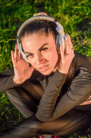 Pretty sporty girl and headphonesの写真素材