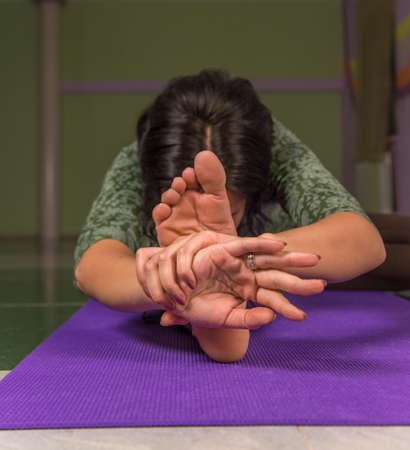 Yogi presenting yoga in the gymの写真素材