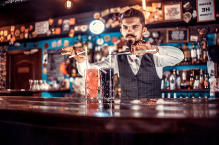 Professional bartender surprises with its skill bar visitorsの写真素材