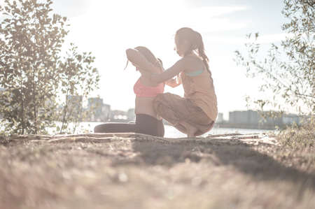 Proffesional masseuse performs a relaxing massage in the forest.の写真素材