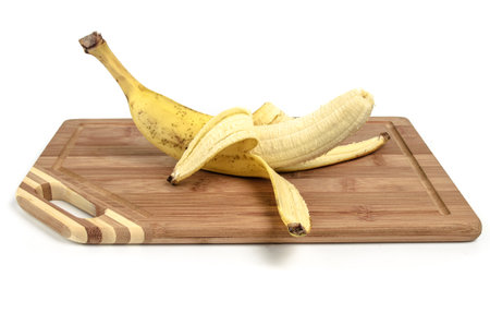 Banana on cutting boardの写真素材