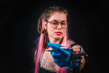 Master tattooist with a tattoo gun in tattoo studioの写真素材