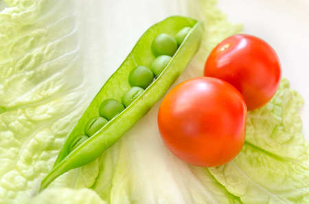 Pod peas and cherry macroの写真素材