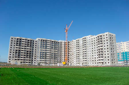 Huge crane and construction of multi-storey buildingの写真素材