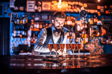 Bartender concocts a cocktail at the brasserieの写真素材