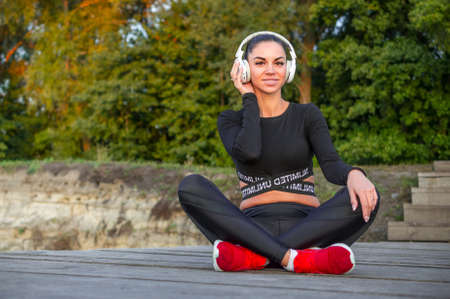 Beautiful woman and headphones listen music and smileの写真素材