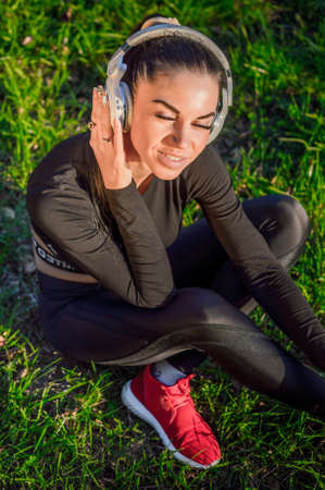 Emotional young woman enjoying musicの写真素材