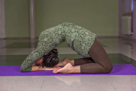 Yoga learner teaching yoga in fitness classの写真素材