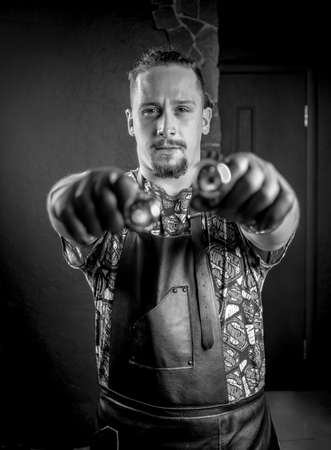 Master tattooist and a tattoo gun in tattoo studioの写真素材