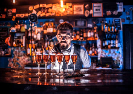 Bartender makes a cocktail on the alehouseの写真素材
