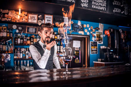 Barman mixes a cocktail at the porterhouseの写真素材