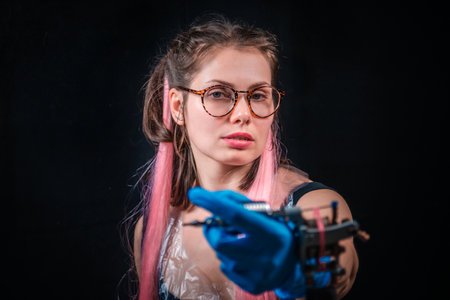 Master tattooist with a tattoo gun in tattoo parlorの写真素材