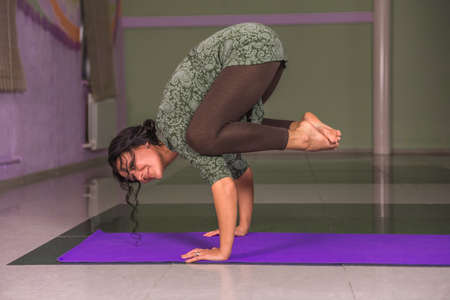 Yoga trainer demonstrating yoga asanaの写真素材
