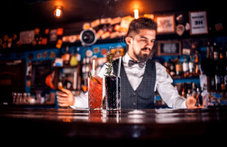 Bartender makes a cocktail at the public houseの写真素材