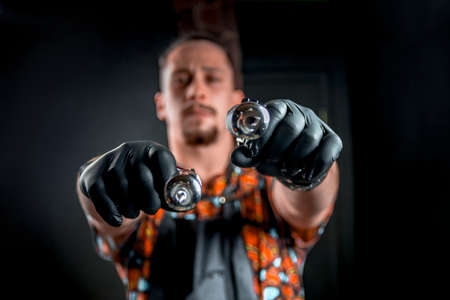 Tattooer with a tattoo-machine in tattoo studioの写真素材