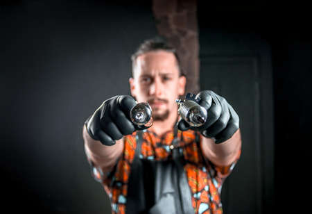 Tattoo master poses for the camera in tattoo parlorの写真素材