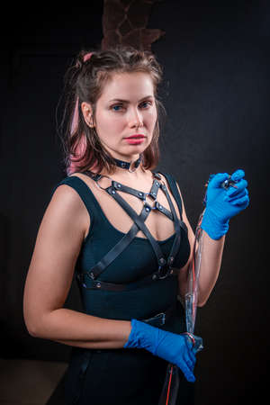 Professional tattooist and a tattoo gun in a tattoo studioの写真素材