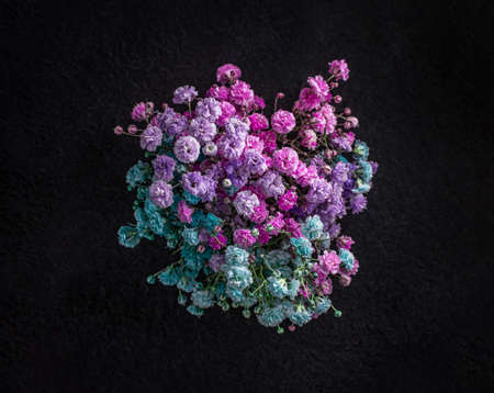 Top view of a flower on black background. Flat lay, top view.の写真素材