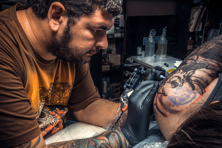 Professional tattooist create tattoo in studioの写真素材