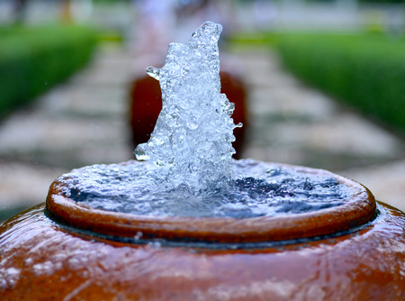 close up jar fountain in the gardenの写真素材