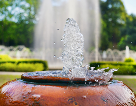 close up jar fountain in the gardenの写真素材