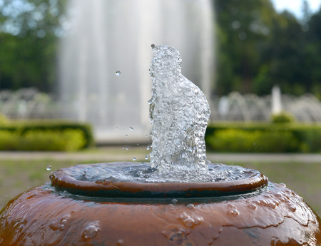 close up jar fountain in the gardenの写真素材